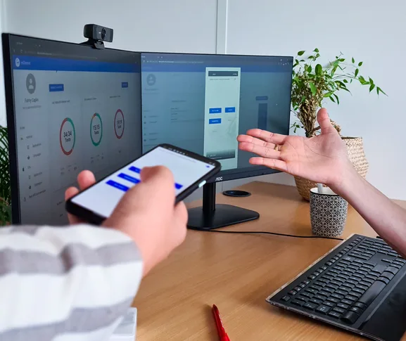 esChecker testing workflow with mobile device and dual-monitor dashboard